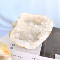 clear quartz crystal geode on book, crystals for the home