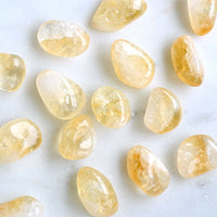 citrine tumbled crystals white background