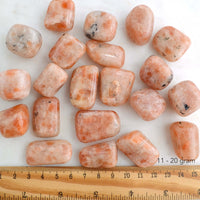sunstone tumbled stones with ruler