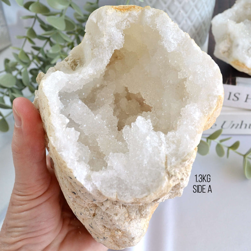 Hand holding a geode crystal 