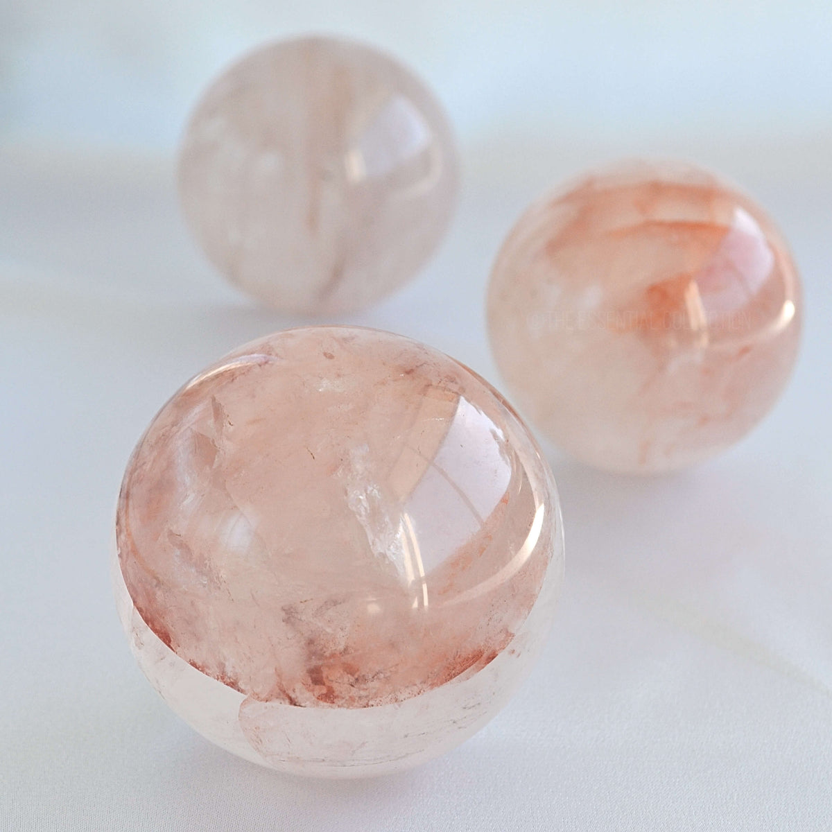 close up of fire quartz crystal sphere with red hematoid inclusions