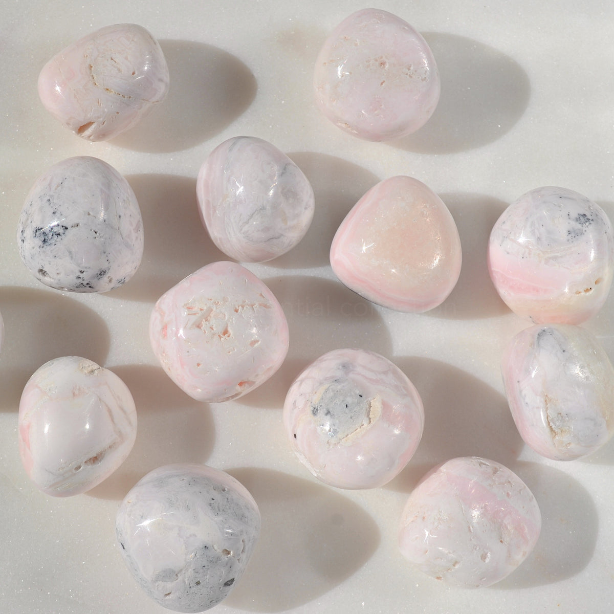 pink mangano calcite tumbled crystals