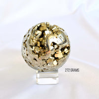 pyrite sphere on glass stand
