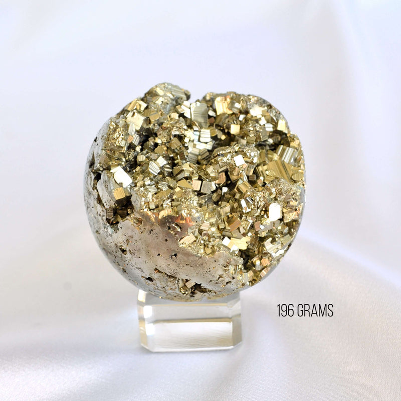 Decorative crystal sphere with gold and gray textures on a white background, labeled '196 Grams'.