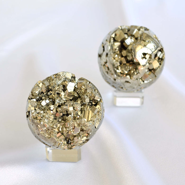 pyrite crystals spheres on glass stand