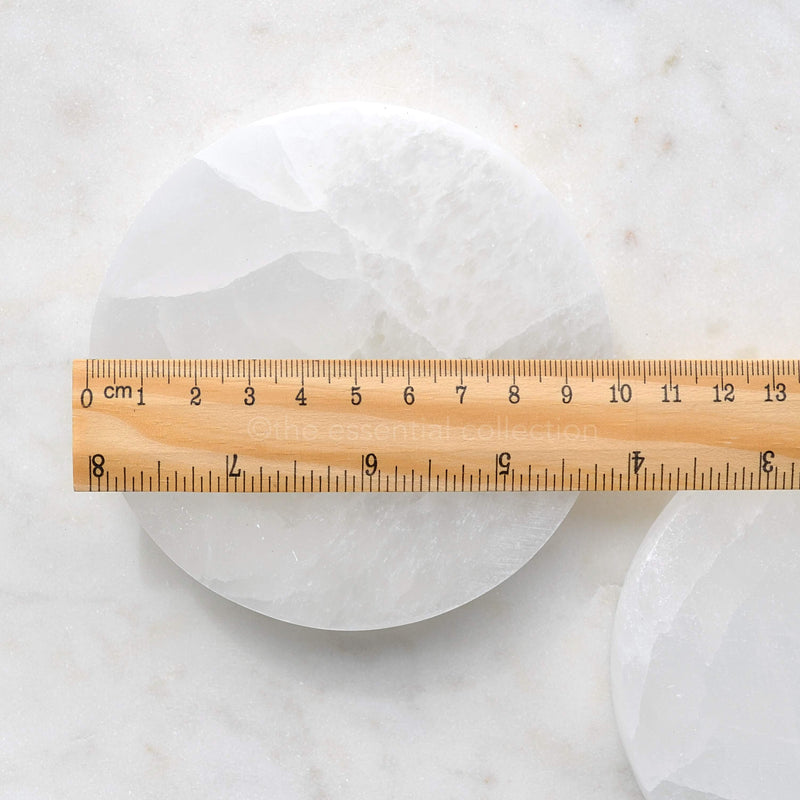 white selenite round charging plate with ruler