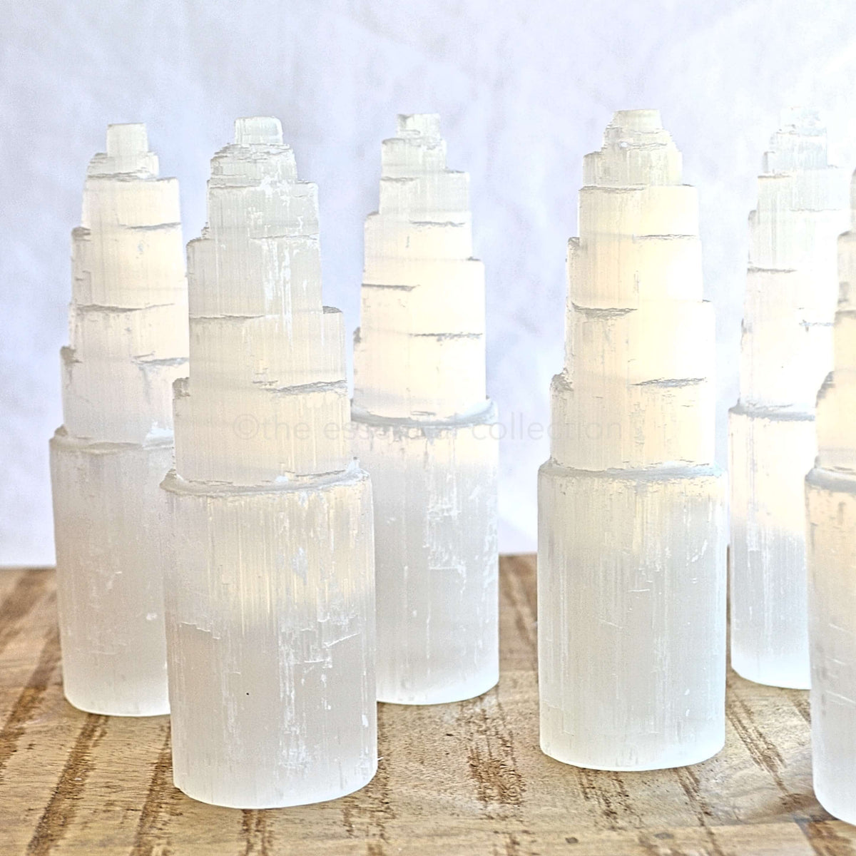 15cm white selenite towers on wood table