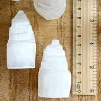 mini 6cm selenite tower with ruler showing height