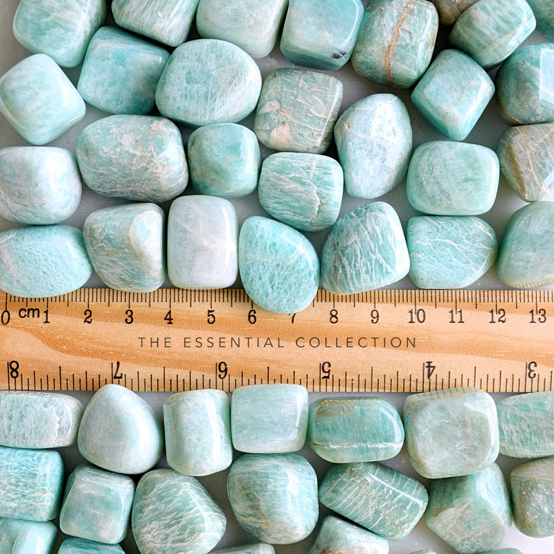 amazonite tumbled crystals with ruler showing size