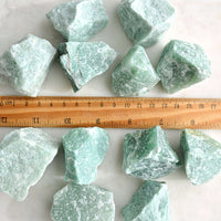 raw rough aventurine crystals with ruler