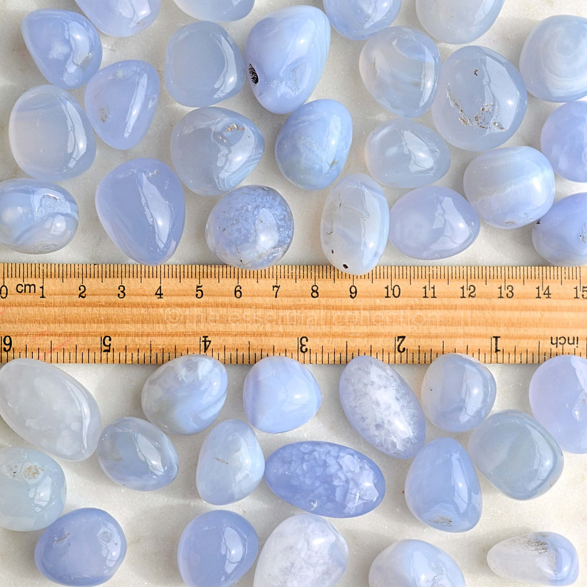 blue chalcedony tumbles with ruler