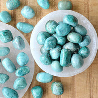 Chrysocolla tumbled crystals gemstones turquoise blue colour white selenite plate bowl round chakra crystals by the essential collection