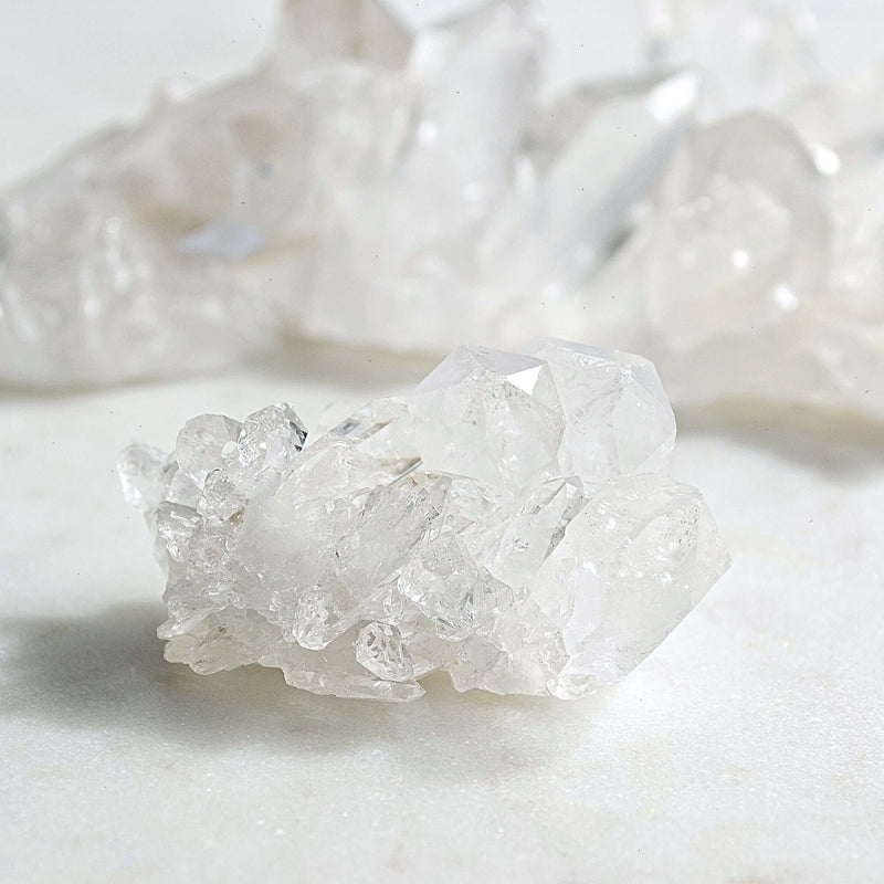 clear quartz cluster white background