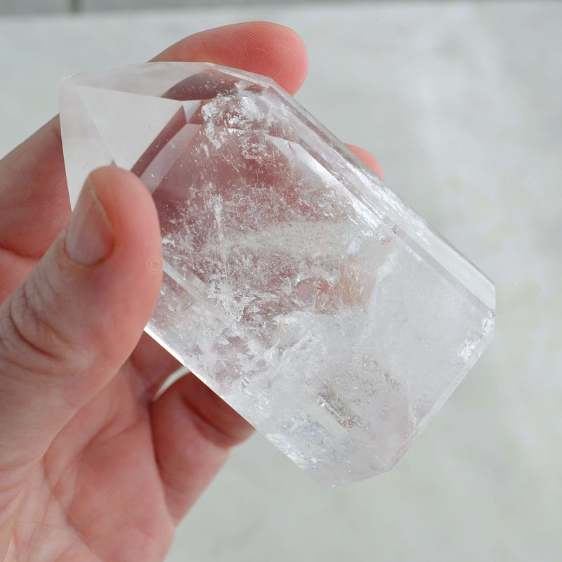 clear quartz crystal generator in hand