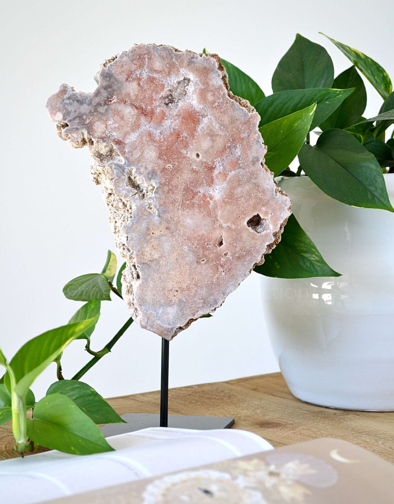 pink amethyst crystal slab on stand