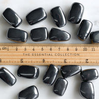 hematite tumbled crystals with ruler showing size