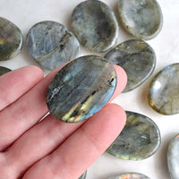 labradorite worry stone in hand