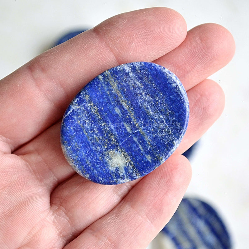 lapis lazuli worry stone in hand