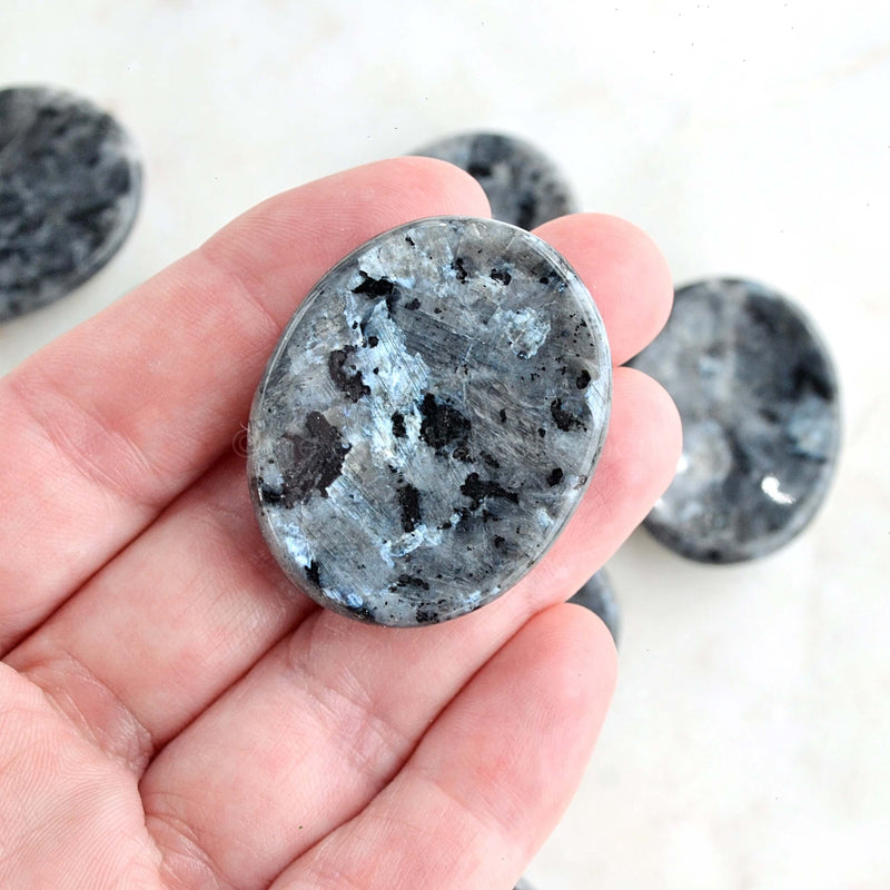 larvikite worry stone crystal in hand