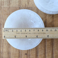 white selenite bowl with ruler for measurement