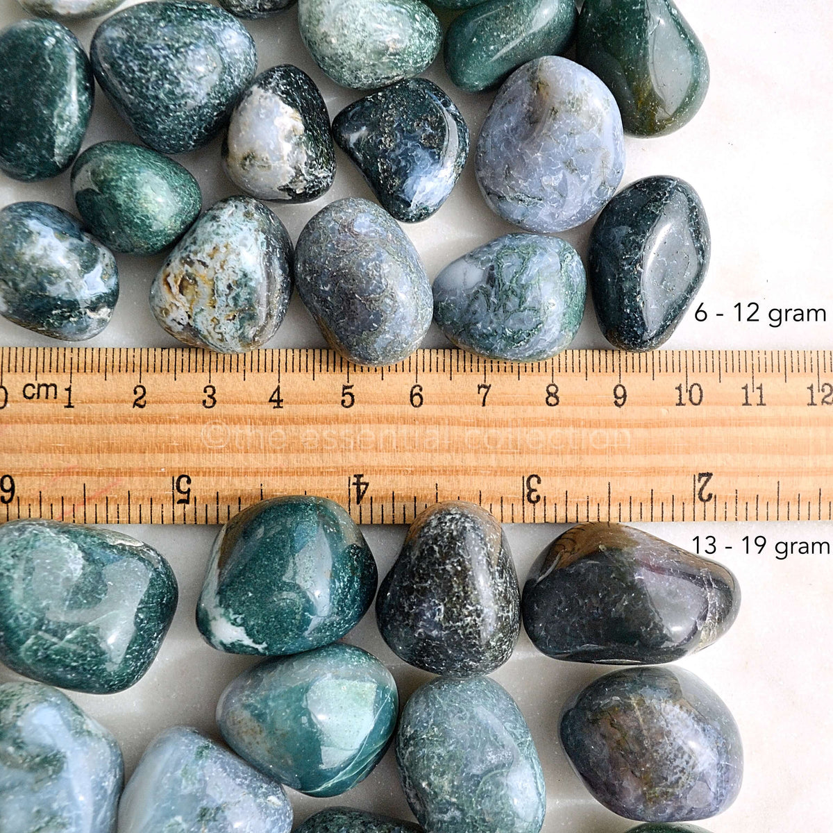 moss agate tumbled crystals with ruler