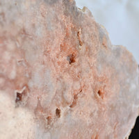 pink amethyst crystal slab on stand