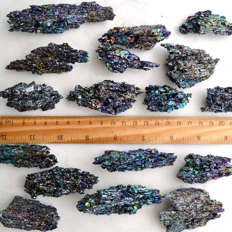 raw rough natural rainbow hematite specimens with ruler