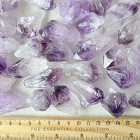 raw natural amethyst points with ruler