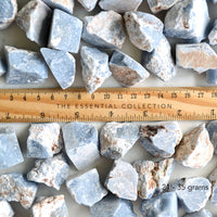 raw angelite crystals with ruler showing size