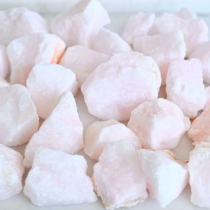raw rough pink aragonite crystals in pile