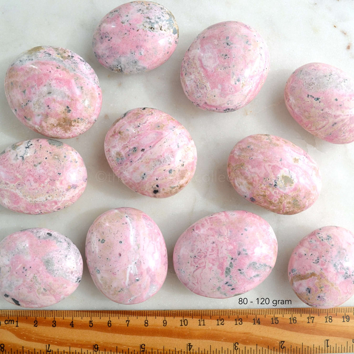 rhodonite palm stones with ruler