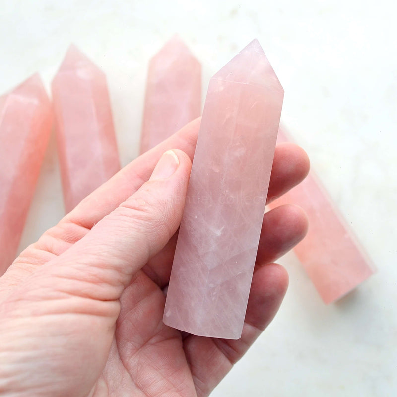 rose quartz tower in hand generators points crystals