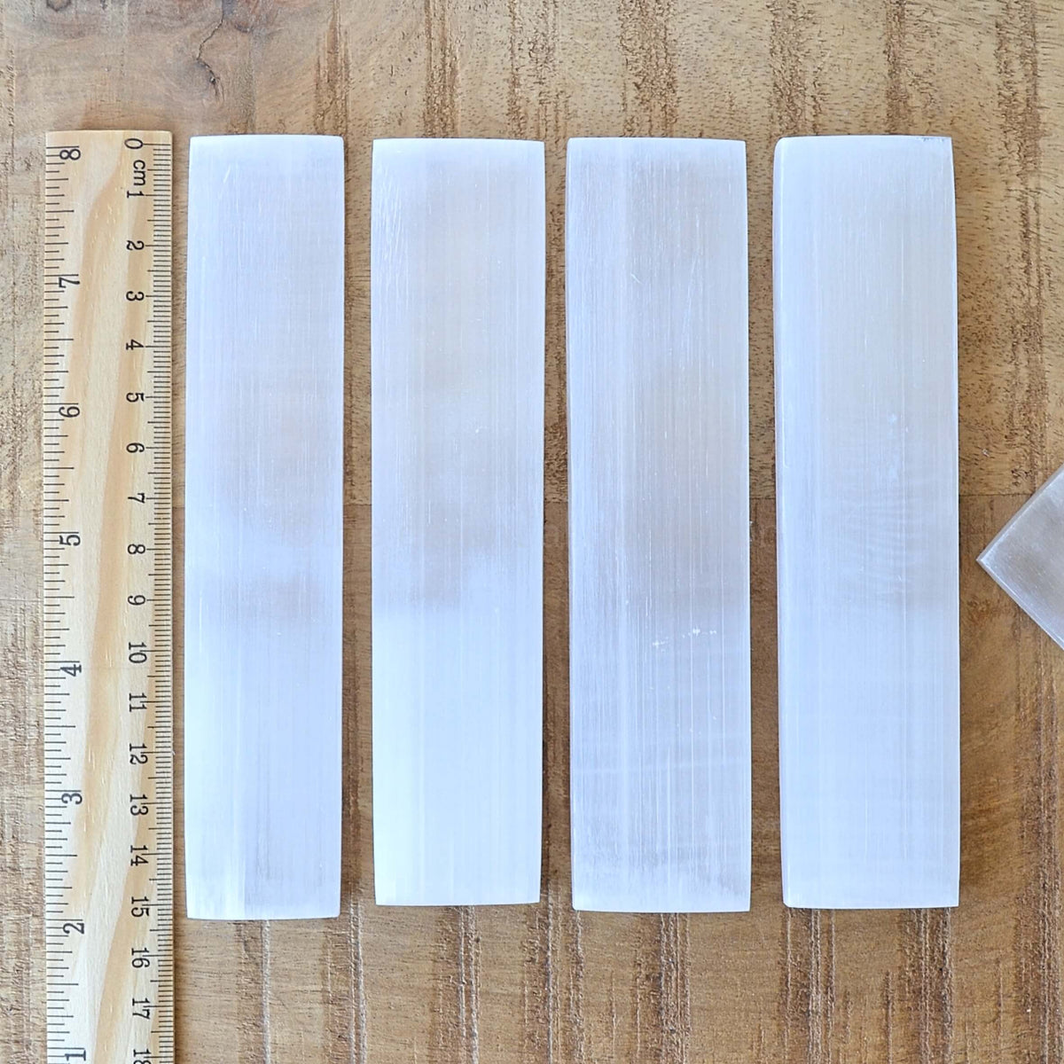 rectangle shaped selenite charging plates 15cm long with ruler showing length