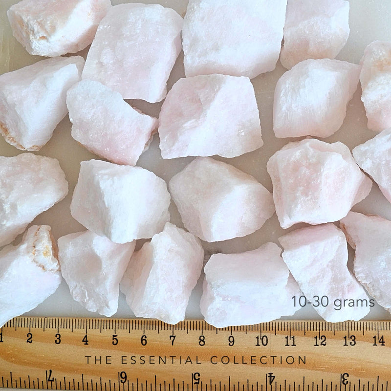 small pink aragonite crystals with ruler