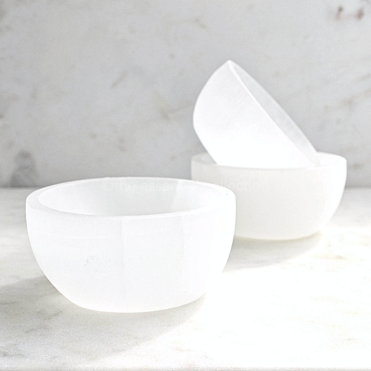 small white selenite bowls stacked