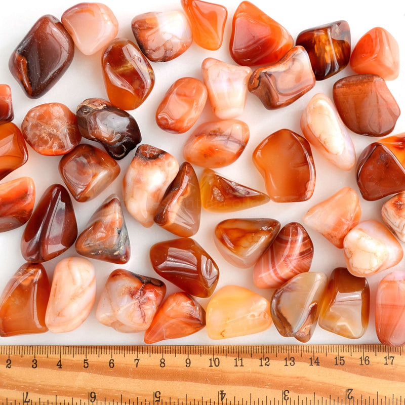 tumbled carnelian crystals with ruler